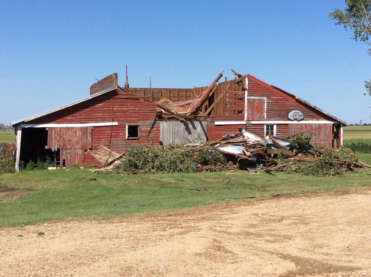 Damage to a barn located 1 mile east of Andover