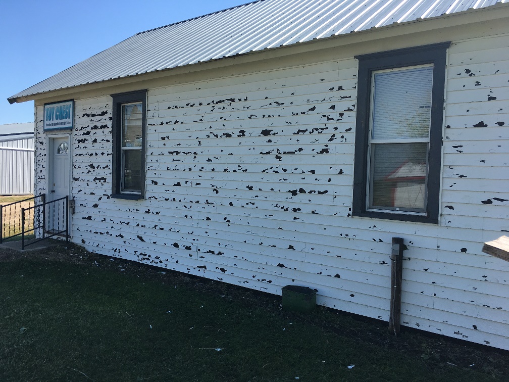 One of the several buildings in Threshermen's Park that were damaged by hail.