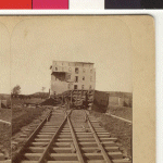 The railroad tracks leading up to Cole's Mill are blocked by an overturned railroad car. John M. Cole, the proprietor of the mill was found dead in the street between the mill and his residence. He had apparently left the mill to go home when he was killed by the storm. 