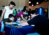 Ryan Vipond helping children draw clouds at Storm Fury 2010 (click to enlarge)