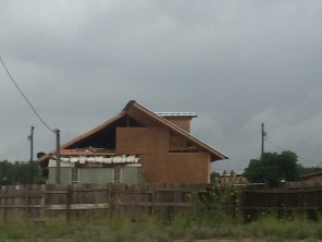 Damage to gable end roof in a colonia in San Carlos, TX, from the late afternoon of May 14, 2016, around 550 PM