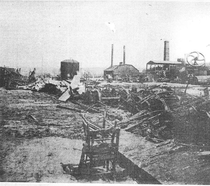 Image of one of several burned oil refineries in Titusville after the fire and floods of June 4-5, 1892. 