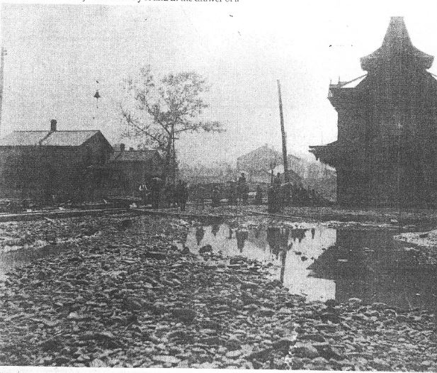 Image of severely damaged train depot in Titusville after the flood and fires of June 5 1892.