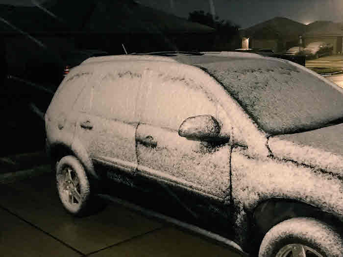 Portland: Car covered in snow