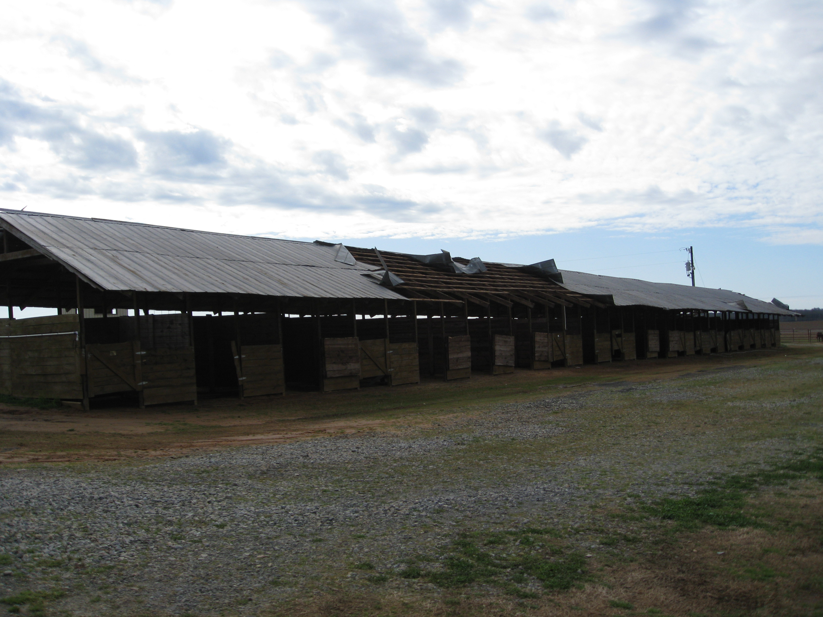 [ Tin roof torn off portion of horse stable near I-75. ]