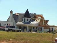 [ home damaged by tornado spawned by Ivan ]