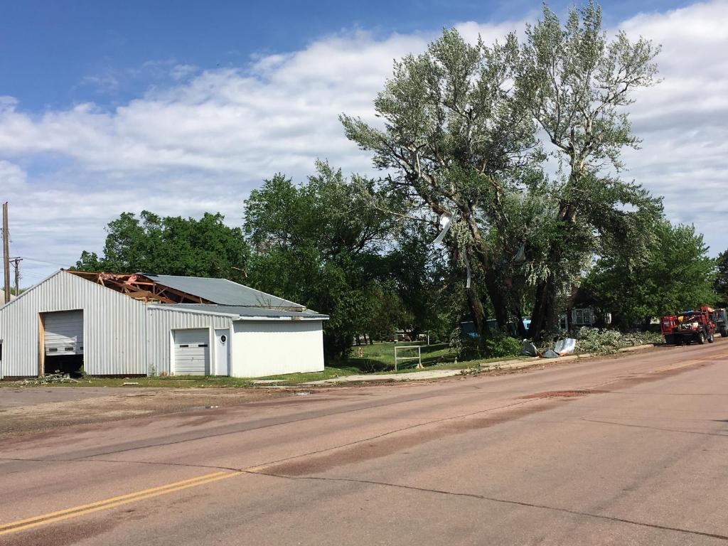 Damage to trees and a building in Armour, SD