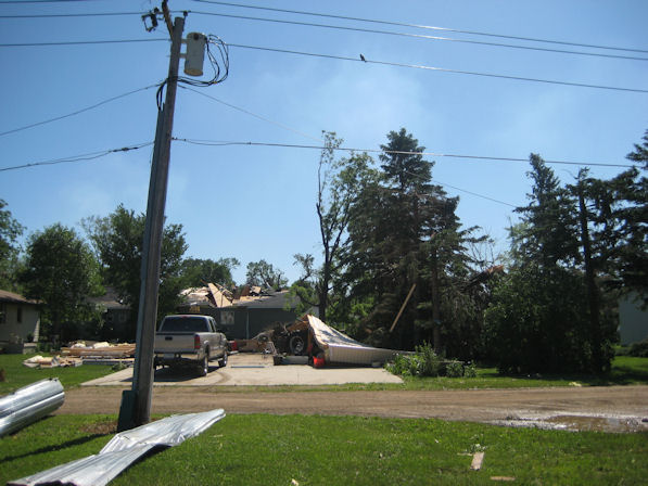 Trees and home damaged by tornado