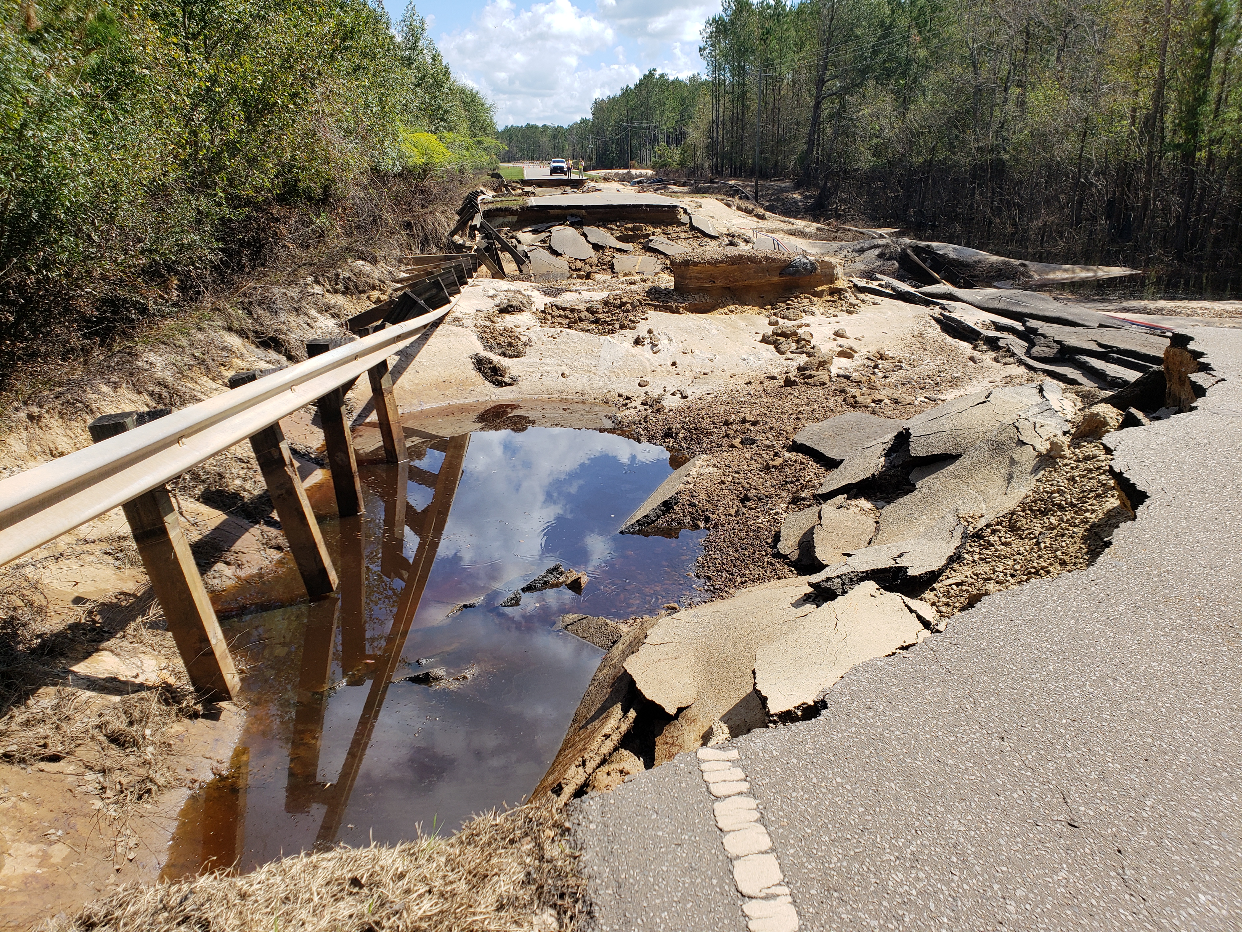 Washout on NC Highway 210 at Moore's Creek. Photo credit: Carl Morgan/NWS)