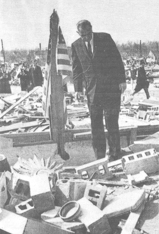 Lyndon Johnson looks at devastation at Dunlap