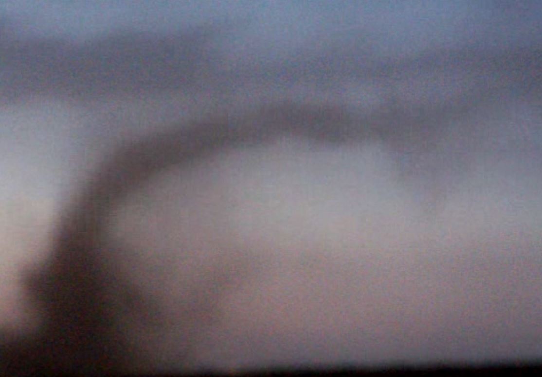 Still capture from a video showing a small tornado to the east of Lubbock