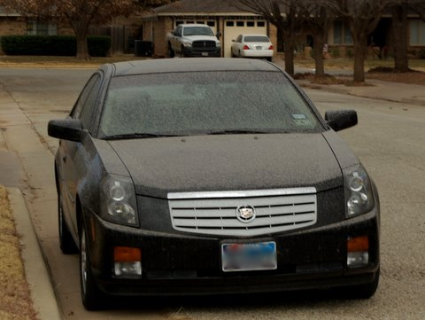 Typical mud coated vehicle after the wind, dust and light rain in Lubbock.