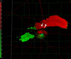 Radar velocity images taken from the Lubbock WSR-88D radar around 7:06 pm CDT on March 19, 2011. The image is scanning the mid-level of the storm, around 10,000 ft above ground level. The green (red) represents air flowing toward (away from) the radar. Click on the radar image for a larger view.