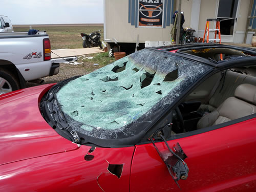 Hail Damage to vehicle from baseball sized hail. Location was near FM 41 and CR 2300. Click on the image for a larger view.