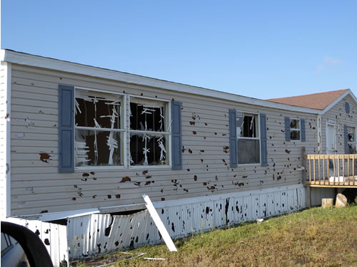 Hail Damage to mobile home from thunderstorms on April 29th. Several mobile were damage along FM 1585 a few miles west of U.S. 62/82. Click on the picture for a bigger view.