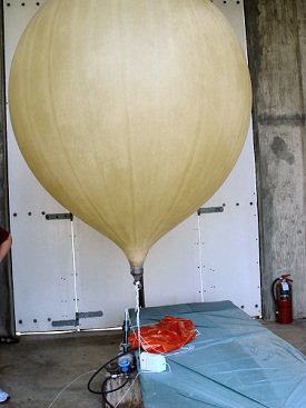 A balloon is about ready for launch inside the inflation shelter at NWS Little Rock (Pulaski County).