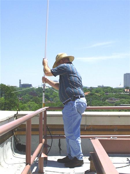 A picture of our HAM antenna begin installed on the roof.