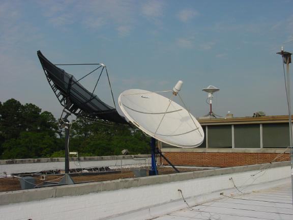 An photo of the Satellite Broadcast Network antenna that sits atop our office.