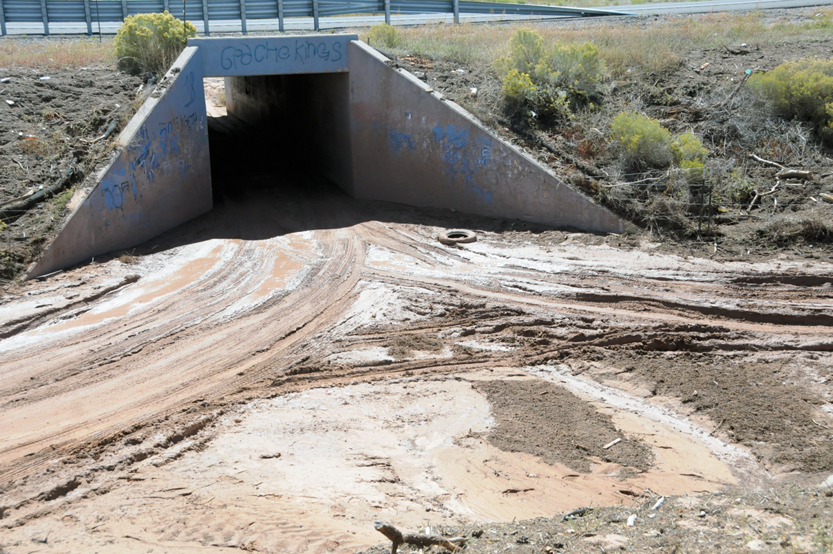 Many drainages like this one on NM Highway 122 were at capacity from excessive flooding and runoff upstream in McKinley county. Photo taken September 19, 2013.