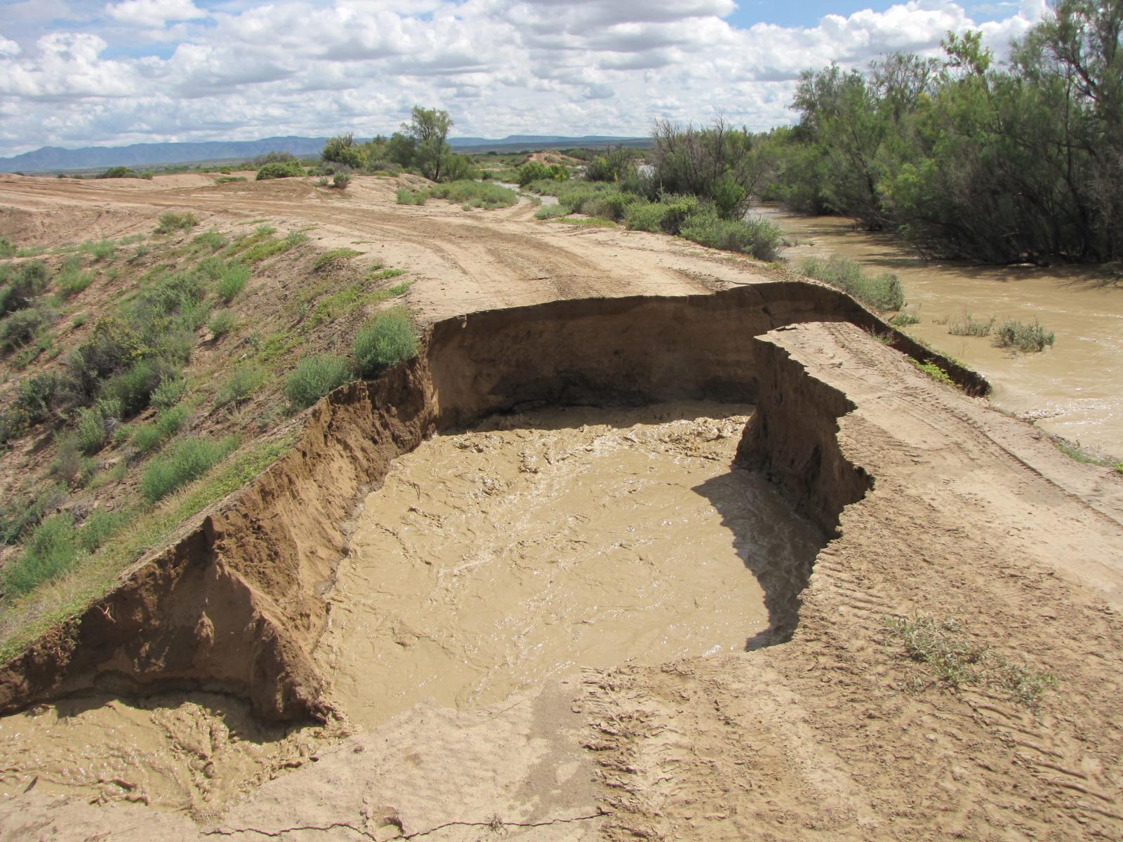 The Rio Puerco breaches its banks near the small community of San Francisico, causing damage to a road.