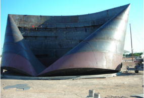 photograph of damaged tank from microburst winds