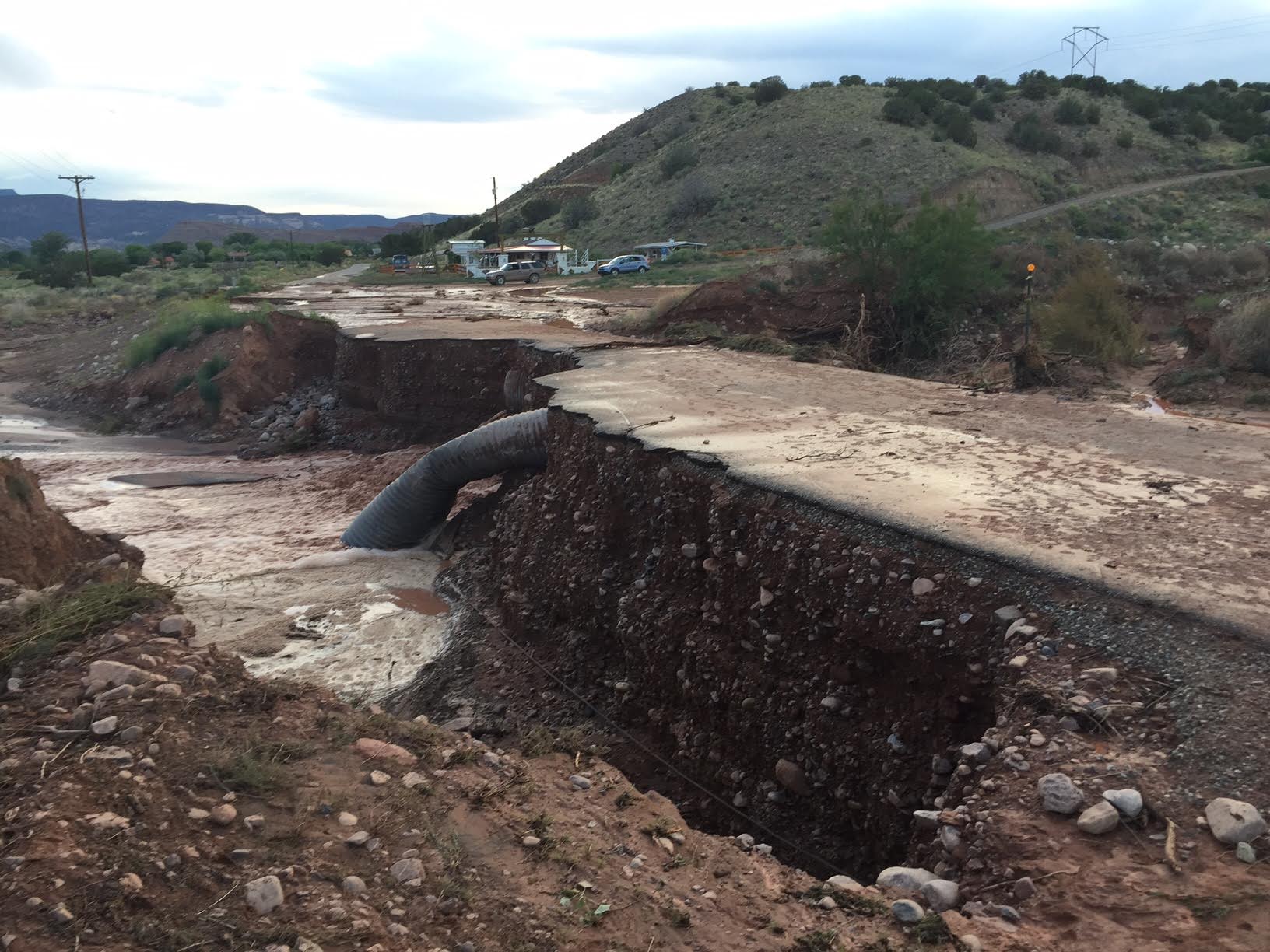 Road damage from a flash flood in Abiquiu, New Mexico