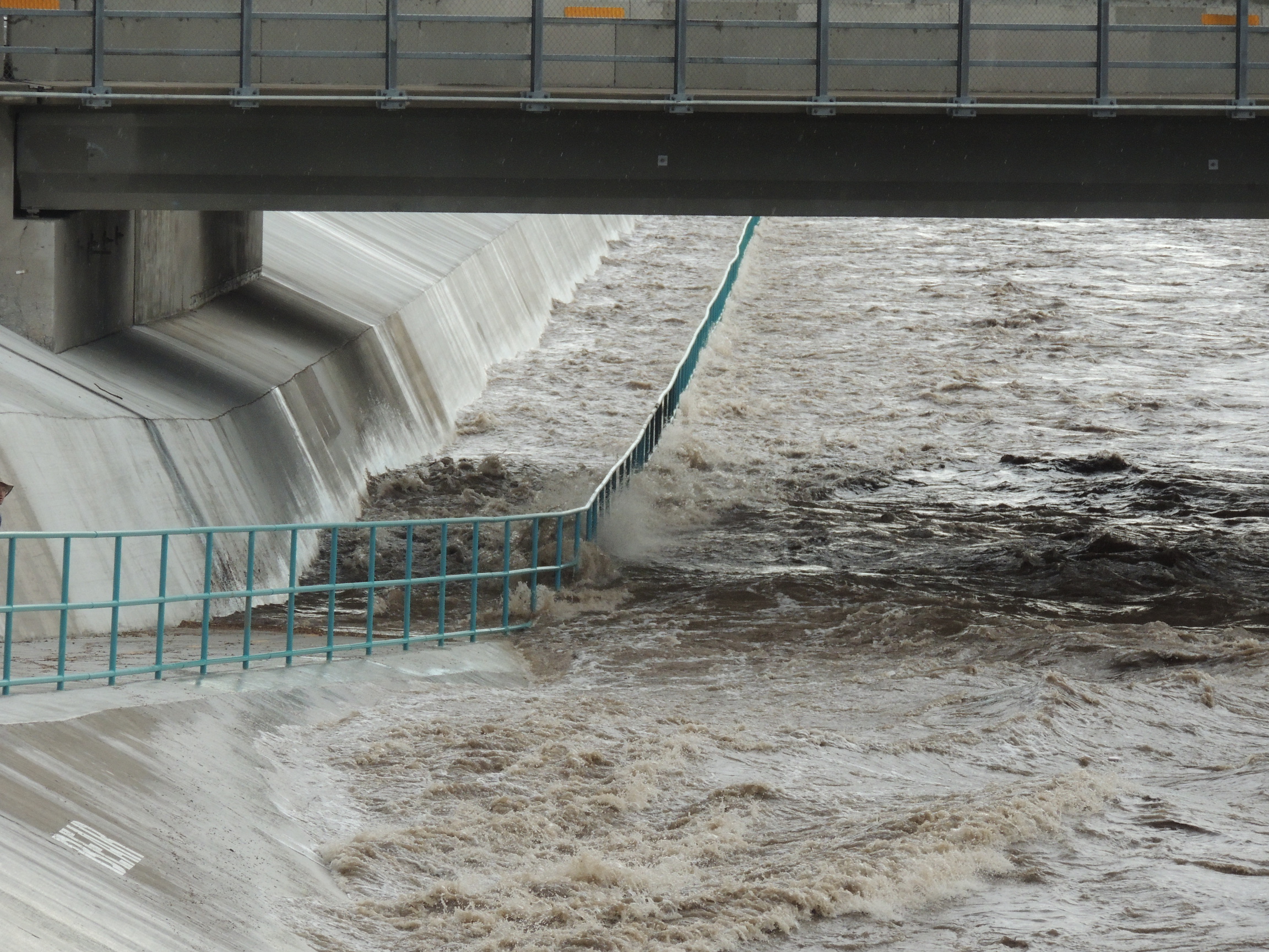 Flood water being carried quickly through an arroyo in Albuquerque, New Mexico