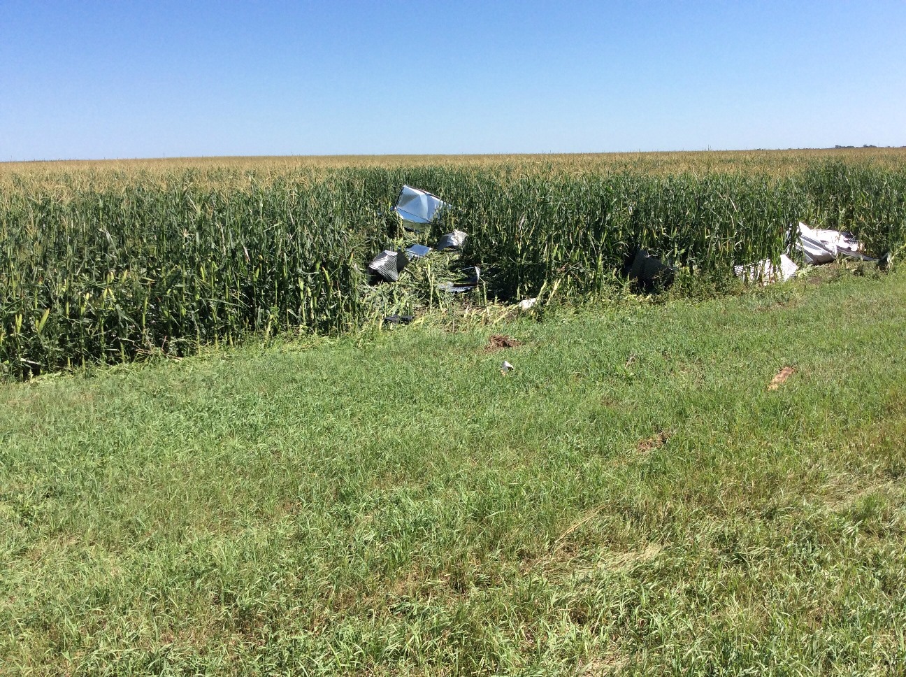 Metal from the outbuilding 1 mile east of Andover was thrown northeast across Highway 12