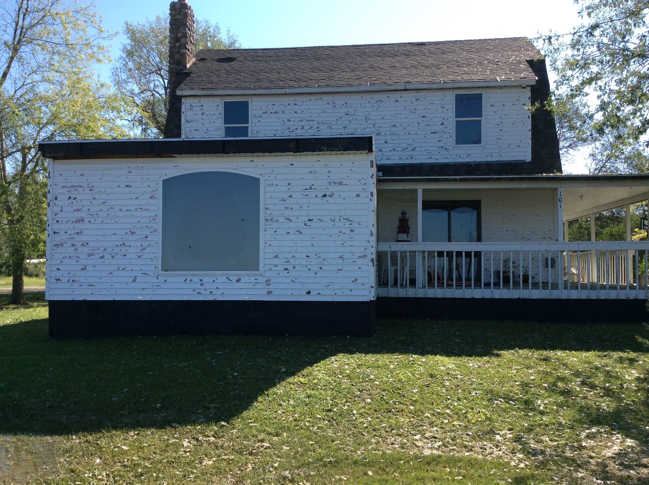 Wind driven hail damage to a house on the west side of Andover