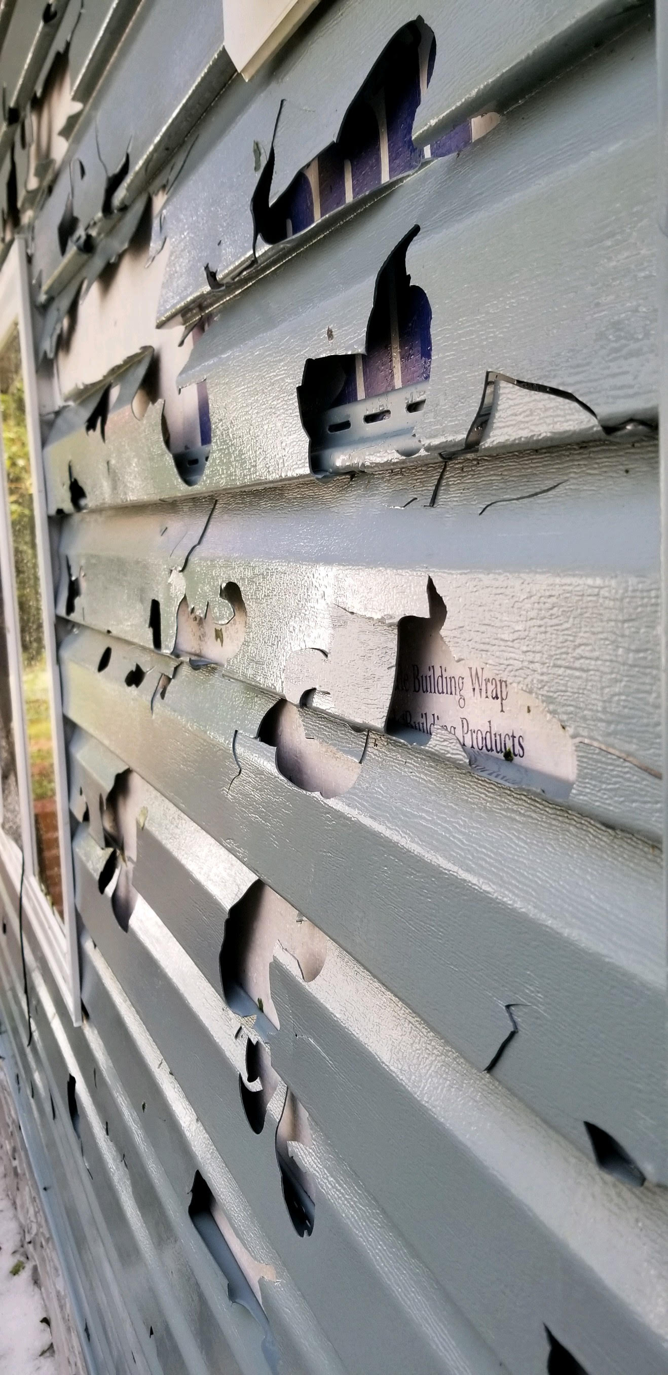 Whitlock Bay area - Hail damaged the siding of a house (Relayed by Edmunds County EM)