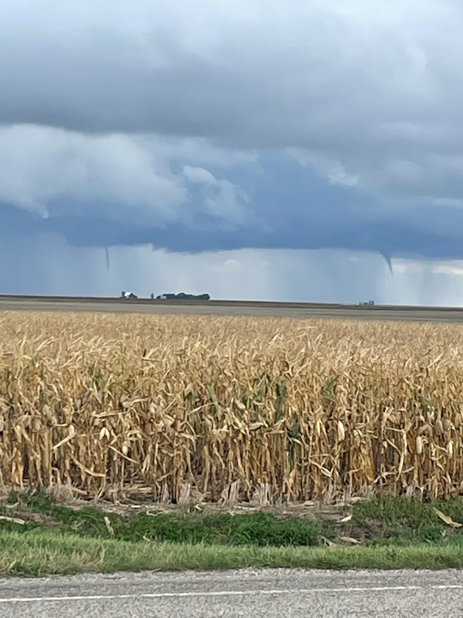 Two landspout funnels (one briefly touched down) located 4 miles west of Onida at approximately 1:15 PM.  (Photo from Sully County EM)