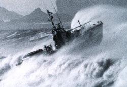 Image of a boat going over a large wave
