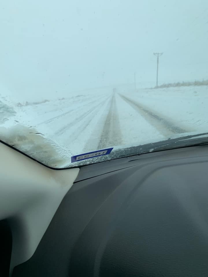 Photo by Esmeralda Munoz of a snow covered FM 722 between Dumas and Channing, Texas on February 15th 2023