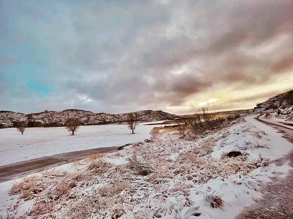 Photo by Joe Addam Benge of a snowy sunset at Harbor Bay, Lake Meredith on February 15th, 2023