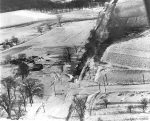Aerial view showing railroad snowplow clearing tracks following blizzard    Source: Minneapolis Star Journal