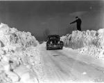 Car between snow banks following Armistice Day blizzard in Minneapolis Photographer: Robert Travis Keagle