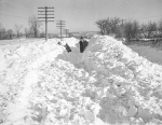 Snowplow and men with shovels attempting to clear road after the Armistice Day blizzard. Source: Minnesota Historical Society