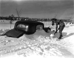 Car at Portland Avenue before Minnehaha Parkway in Minneapolis following Armistice Day blizzard Photographer: Robert Travis Keagle