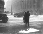 People and cars on the street in Minneapolis during Armistice Day blizzard    Source: Minneapolis Star Journal