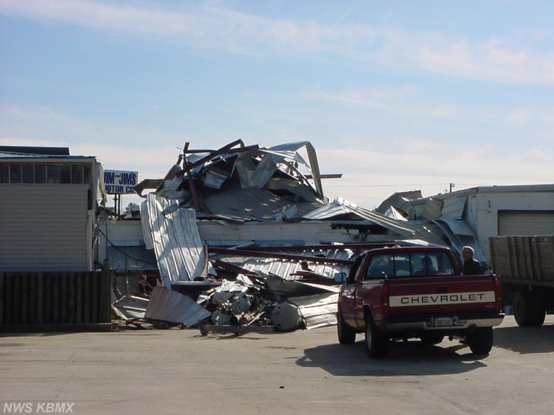 Damage to back of automotive repair shop Homewood area. Click for a large image.