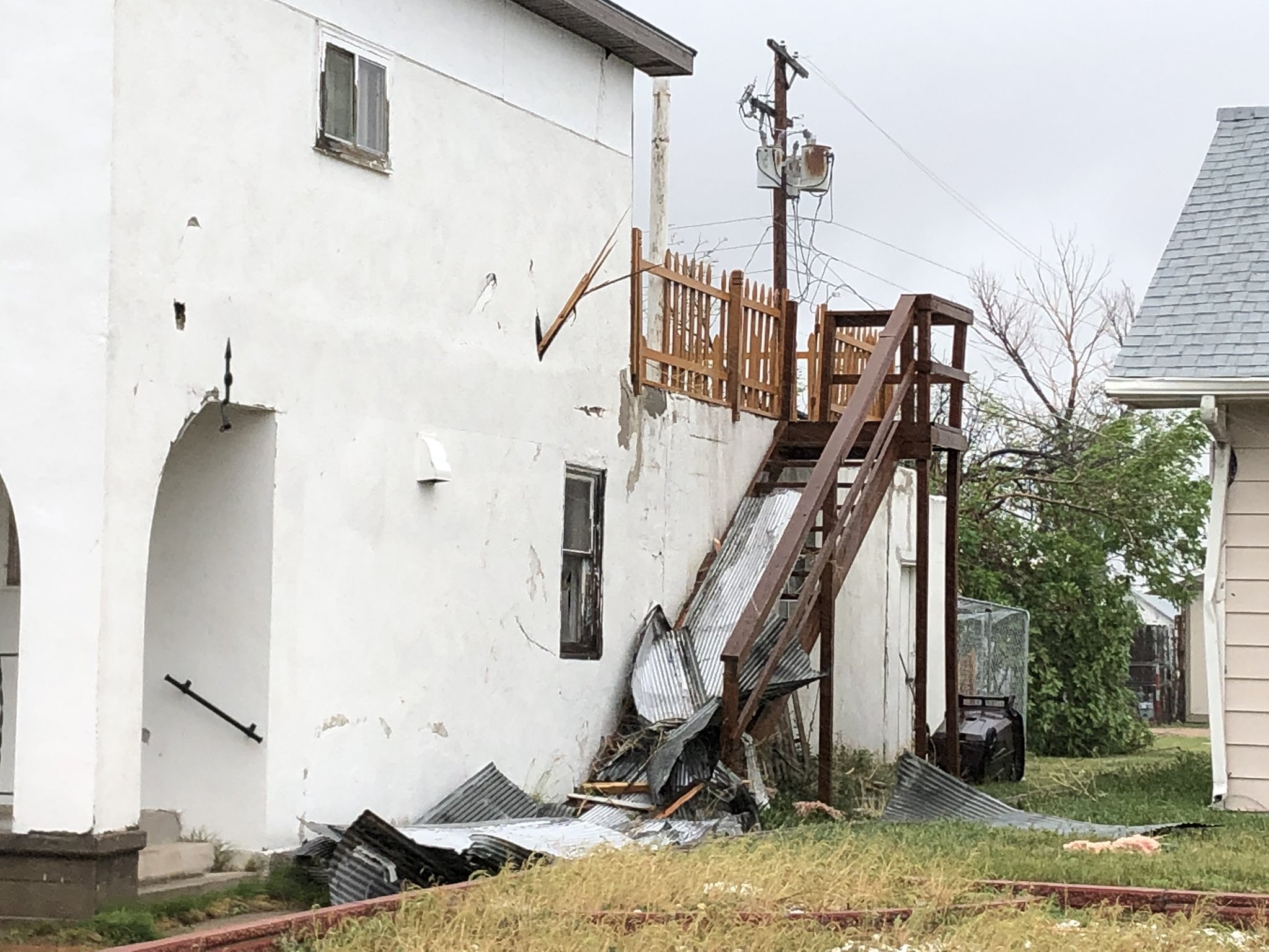 Board blown into house wall, Akron CO June 6 2020