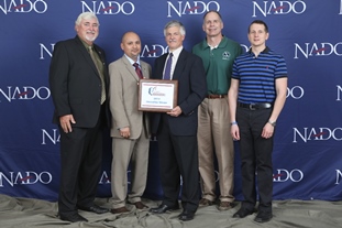 Manuel Cruz poses with Steve Drillette and  Doug Butts of NWS Brownsville/Rio Grande Valley at the 2014 NADO Innovation Awards Ceremony in Denver, Colo.