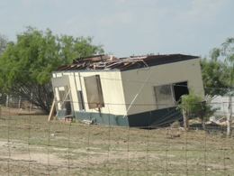 Photo of rolled trailer just west of Raymondville, evening of May 24th, 2009 (click to enlarge)