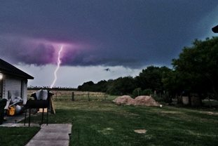 Photograph of cloud to ground lightning strike prior to arrival of thunderstorm in Brownsville, between 415 and 430 PM on May 28, 2014 (click to enlarge)