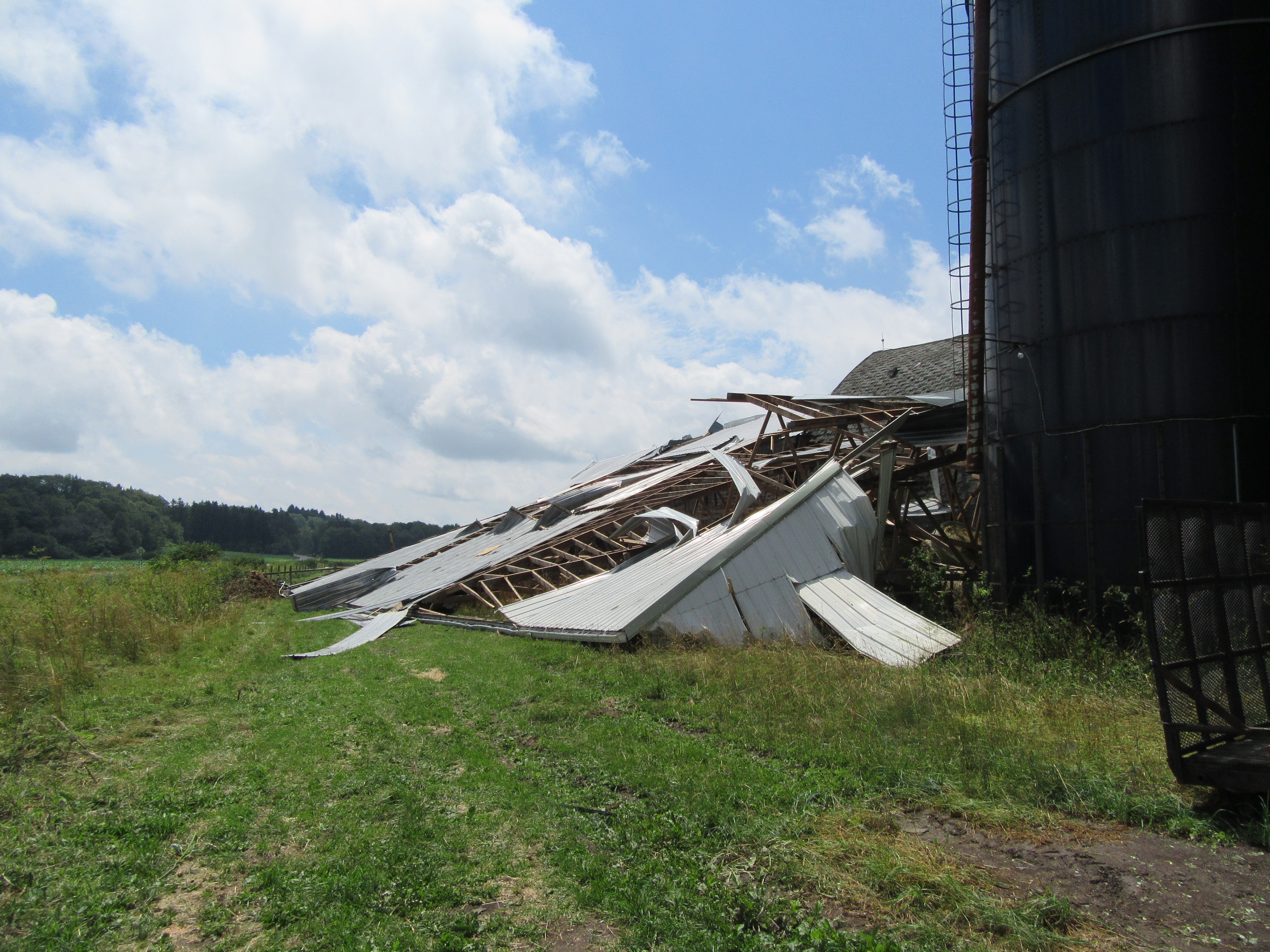 Extensive barn damage near the start of the tornado path