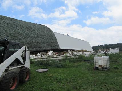 Extensive barn damage near the start of the tornado path