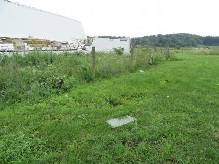 Extensive barn damage near the start of the tornado path