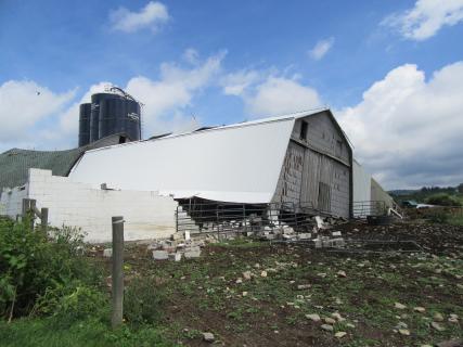Extensive barn damage near the start of the tornado path