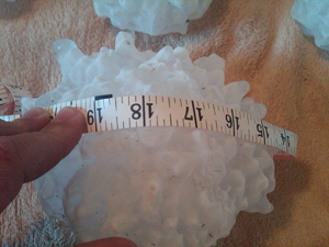 Irregular shaped hailstone approximately 3 to 4 inches in diameter