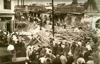 Rescue crews search through tornado damage at the City Market.
